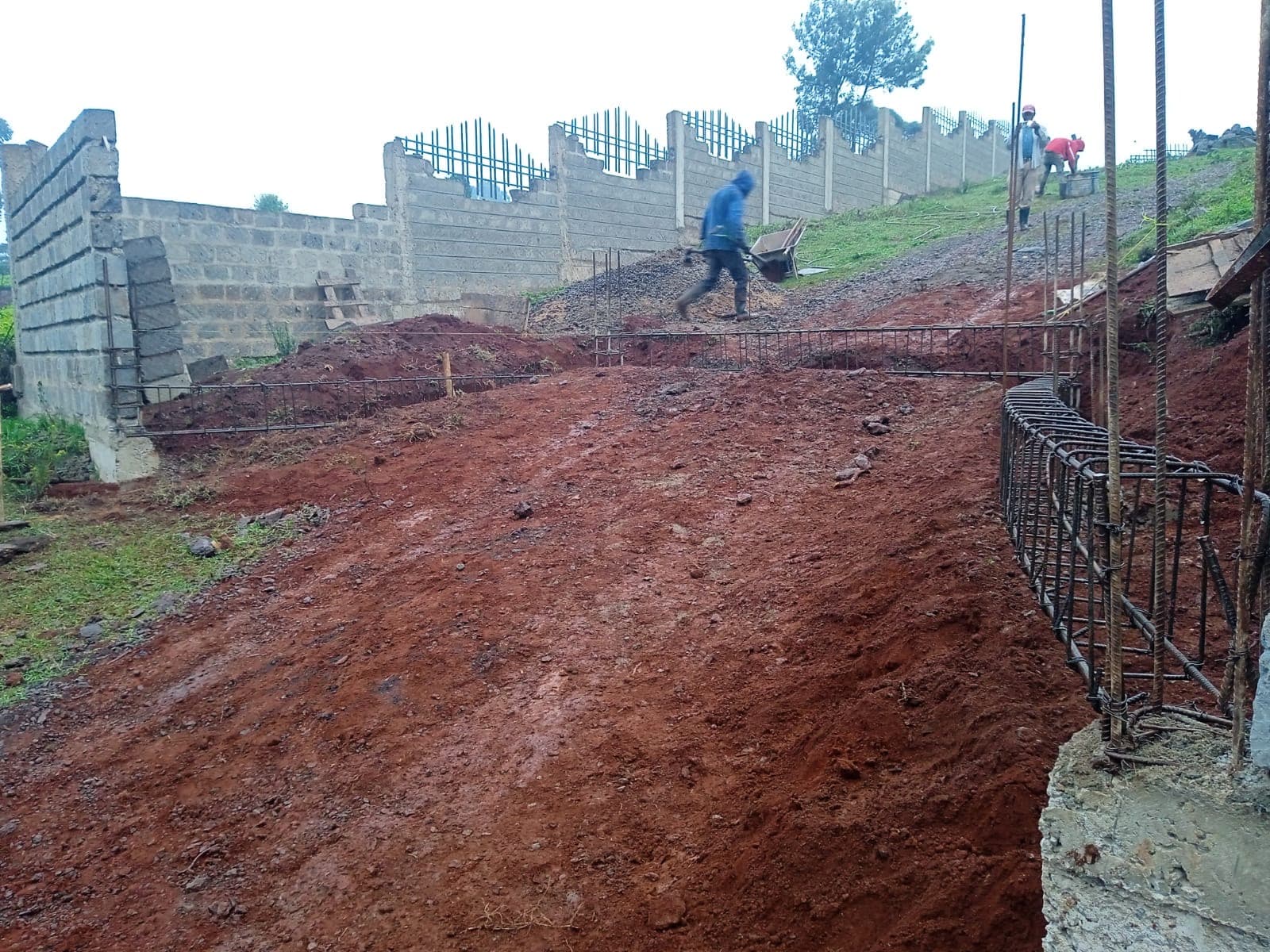 Construction site with foundation work and rebar reinforcement
