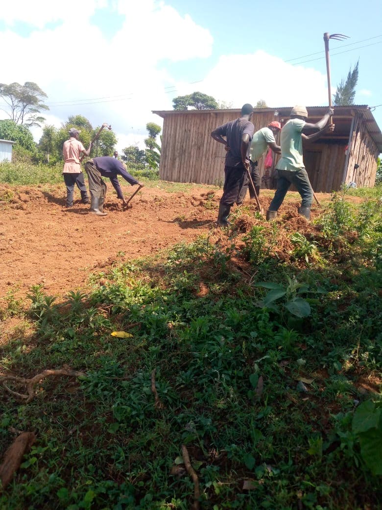 Community members working together to prepare the land