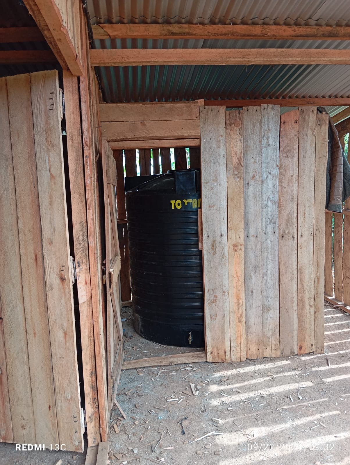 Water storage tank installed inside the wooden building